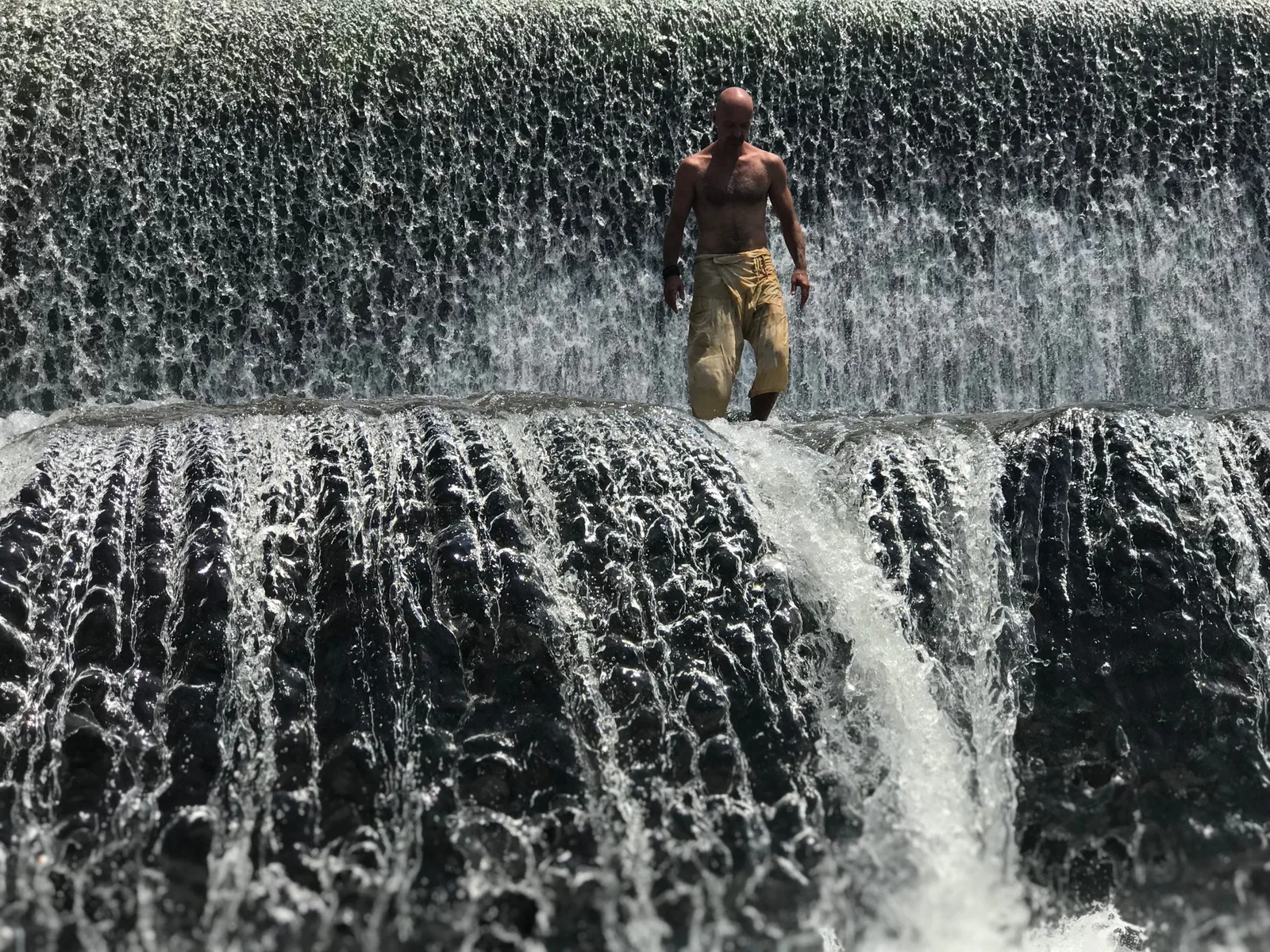 Tobias in a waterfall — honoring nature